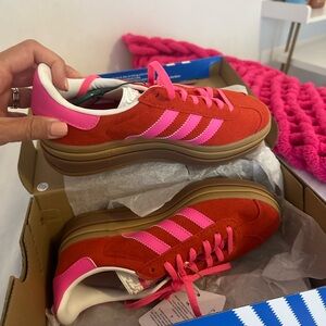 Red and pink women’s adidas gazelle size 5. Brand new,never worn,comes with box.